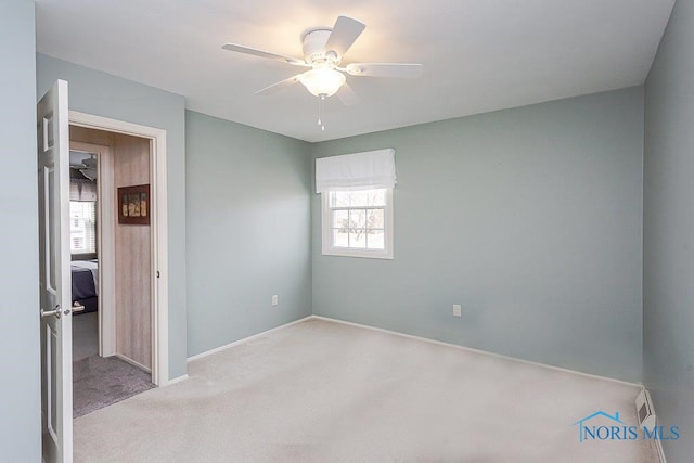 unfurnished bedroom with light colored carpet and ceiling fan