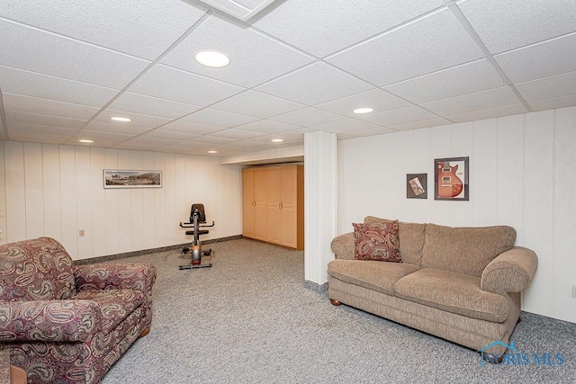 living room with a paneled ceiling