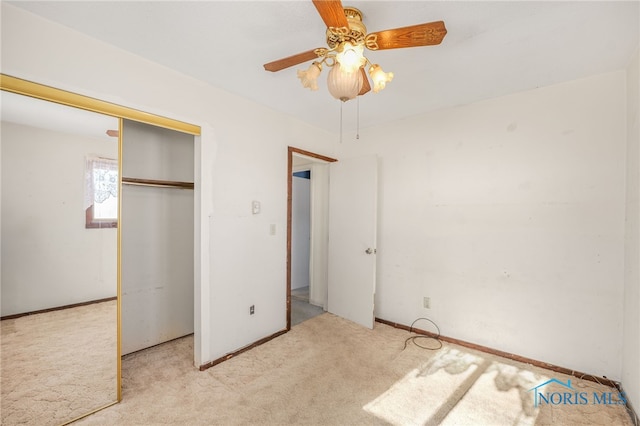 unfurnished bedroom with ceiling fan, light colored carpet, and a closet