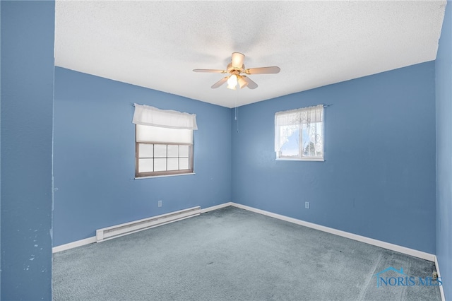 carpeted spare room with ceiling fan, a baseboard radiator, and a textured ceiling