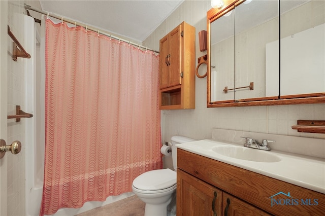 full bathroom featuring vanity, toilet, and shower / bath combo with shower curtain