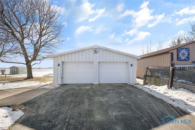 view of snow covered garage