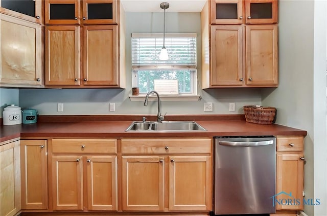 kitchen featuring dishwasher, sink, and pendant lighting