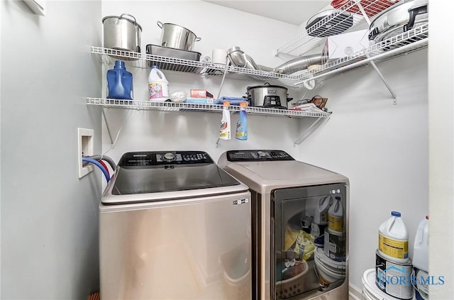 washroom featuring washer and clothes dryer