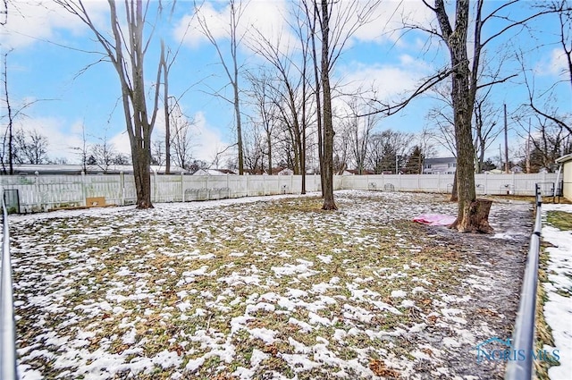 view of yard layered in snow