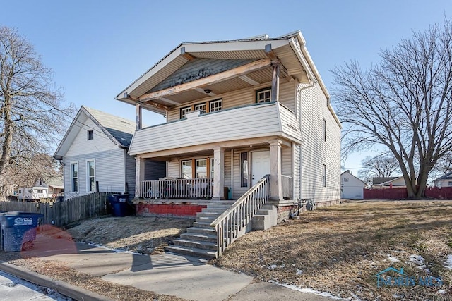 front facade featuring a balcony and covered porch