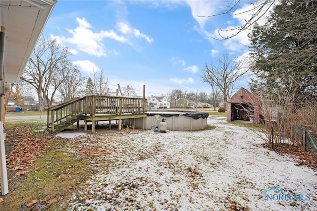 view of yard with a swimming pool side deck