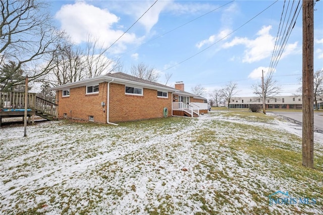 view of snow covered property