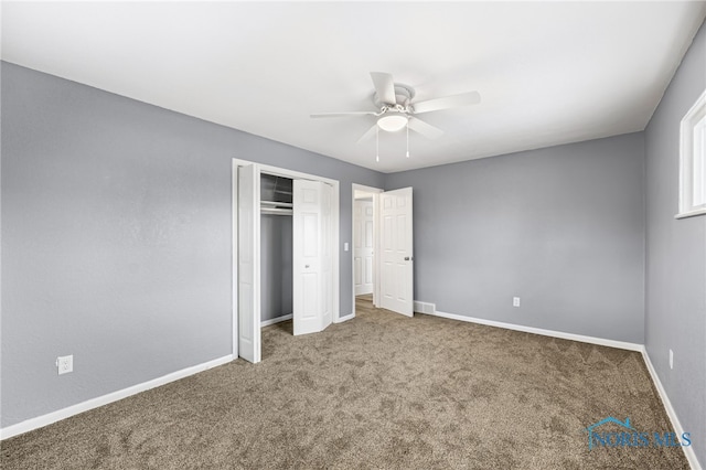 unfurnished bedroom featuring ceiling fan, carpet flooring, and a closet