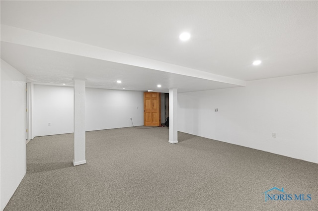 basement with light colored carpet