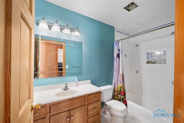 full bathroom with vanity, shower / tub combo with curtain, and toilet