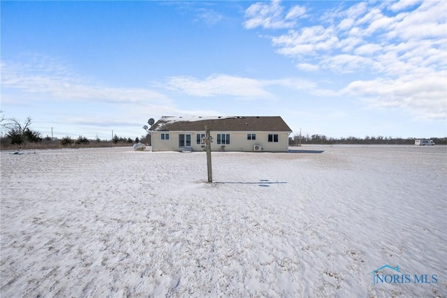 back of property featuring a water view