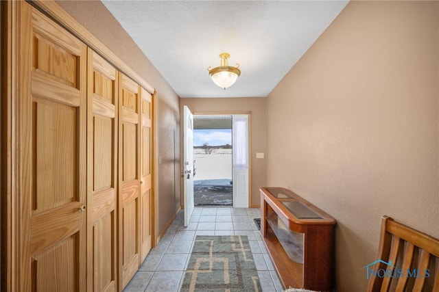 hallway with light tile patterned floors