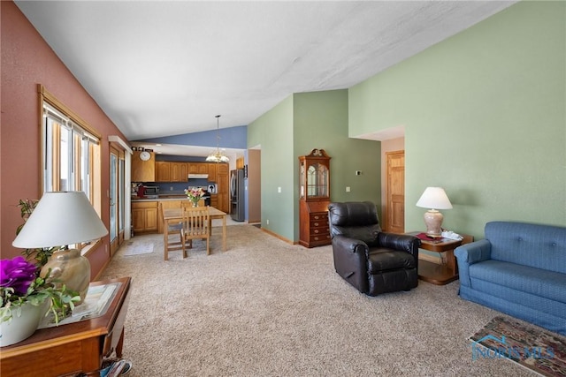 carpeted living room featuring high vaulted ceiling