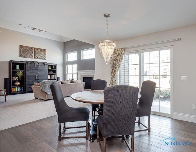 dining room with a chandelier and hardwood / wood-style floors