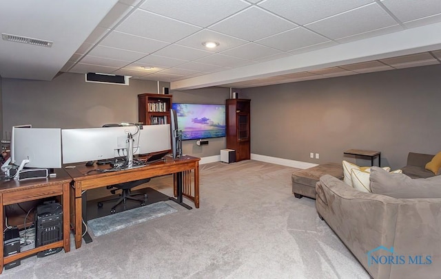 office featuring a paneled ceiling and carpet flooring