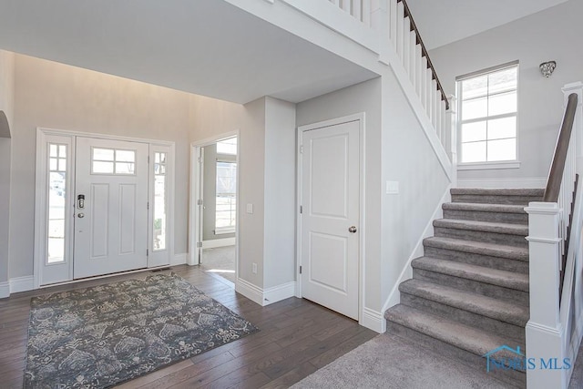 entryway with dark wood-type flooring