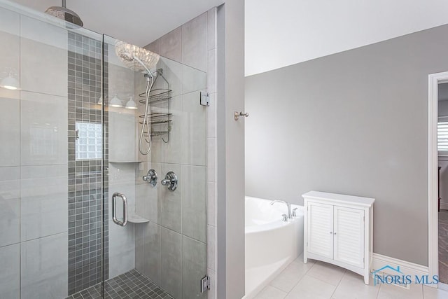 bathroom featuring tile patterned floors and plus walk in shower