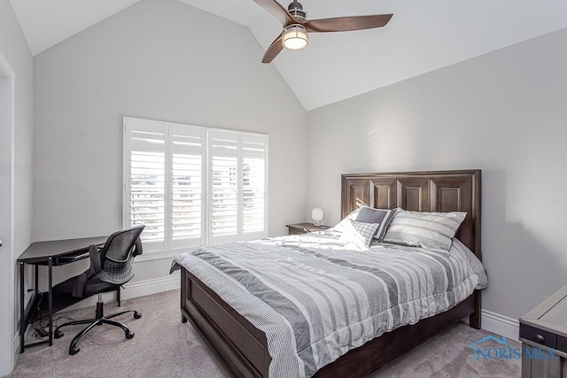 carpeted bedroom with ceiling fan and vaulted ceiling