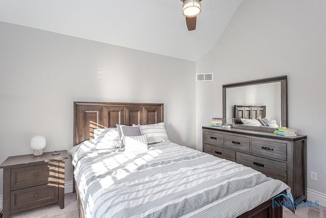 bedroom with lofted ceiling, light carpet, and ceiling fan