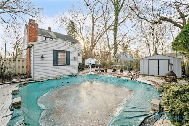 view of pool featuring a storage unit