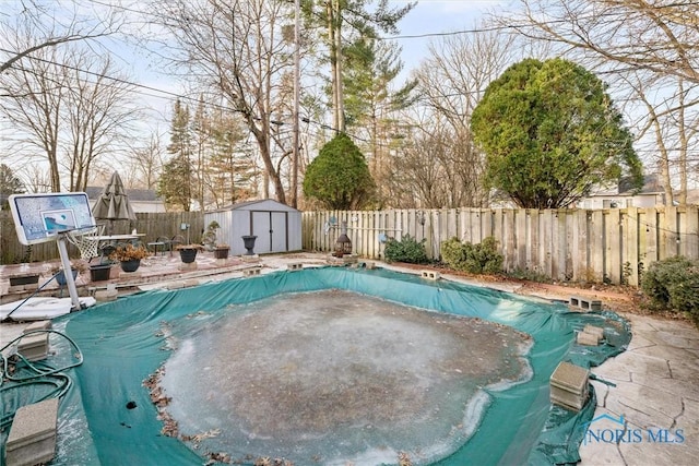 view of pool with a shed