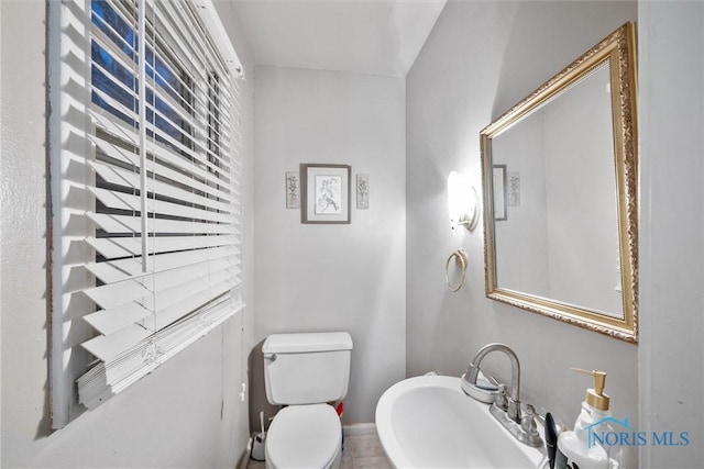 bathroom featuring sink and toilet