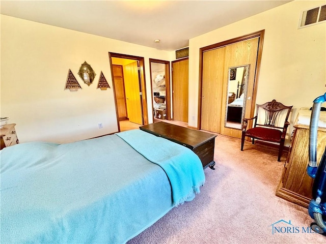 bedroom with light colored carpet