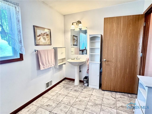 bathroom featuring tile patterned floors and sink