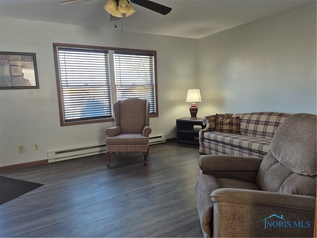 living room with ceiling fan, a baseboard heating unit, and dark hardwood / wood-style flooring