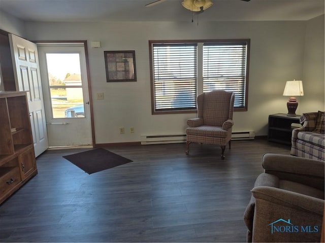 interior space with ceiling fan, dark hardwood / wood-style flooring, and a baseboard radiator