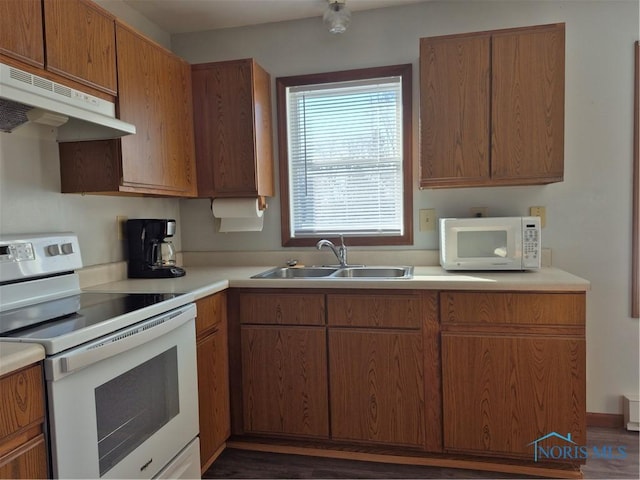 kitchen featuring sink and white appliances