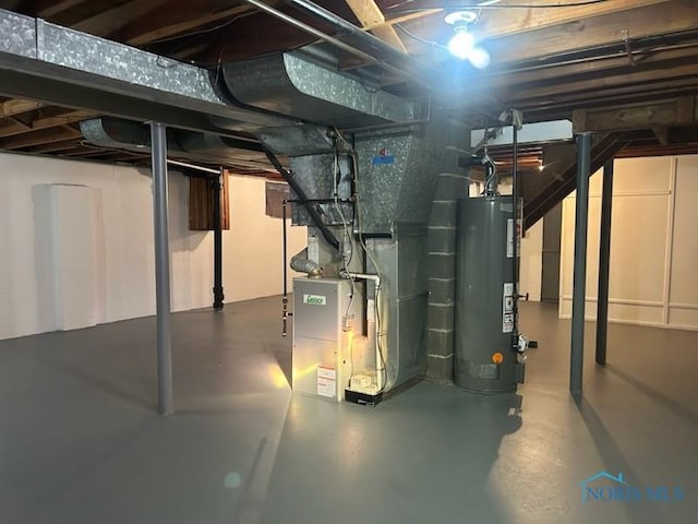 basement with heating unit and water heater