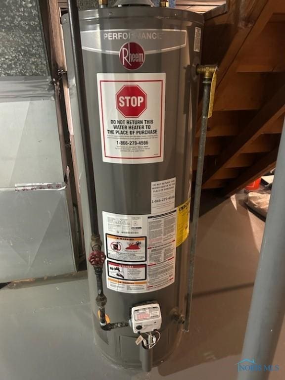 utility room featuring gas water heater