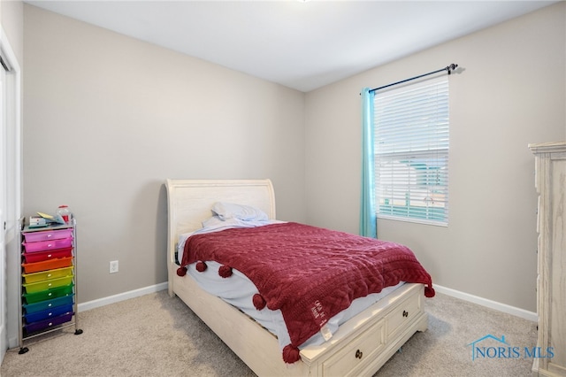 bedroom featuring light colored carpet