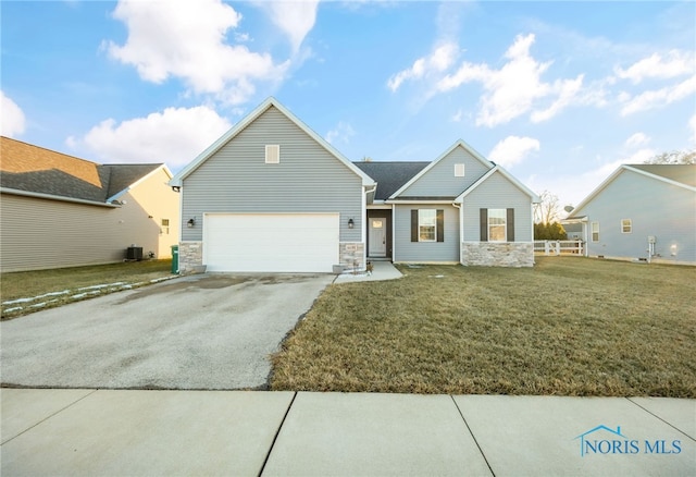 view of front of property with a garage and a front yard