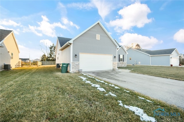 view of home's exterior featuring central AC unit and a lawn