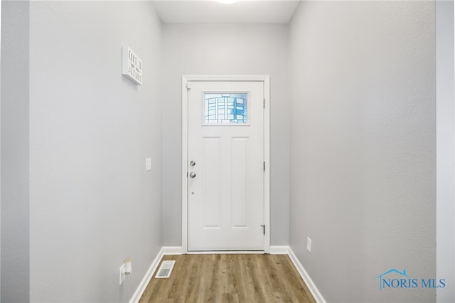 doorway to outside featuring light wood-type flooring