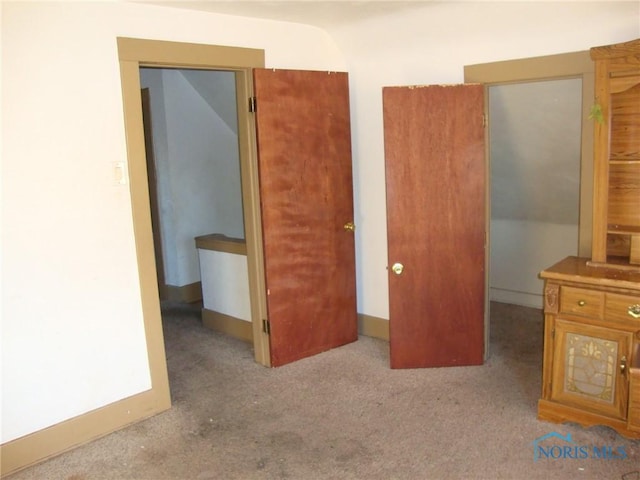 unfurnished bedroom with light carpet