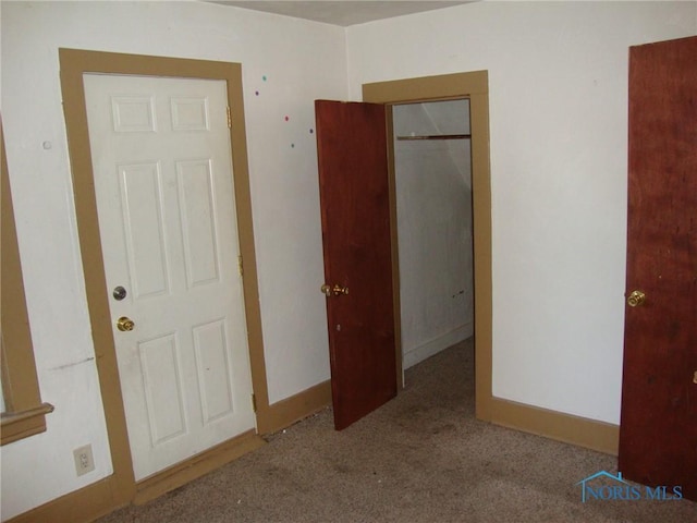 unfurnished bedroom with light carpet