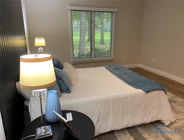 bedroom featuring wood-type flooring