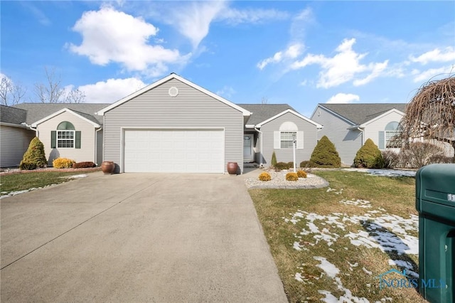 single story home featuring a garage and a front lawn