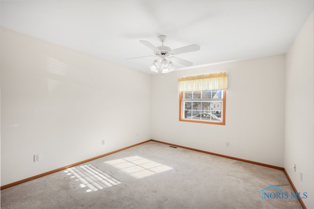 carpeted empty room with ceiling fan