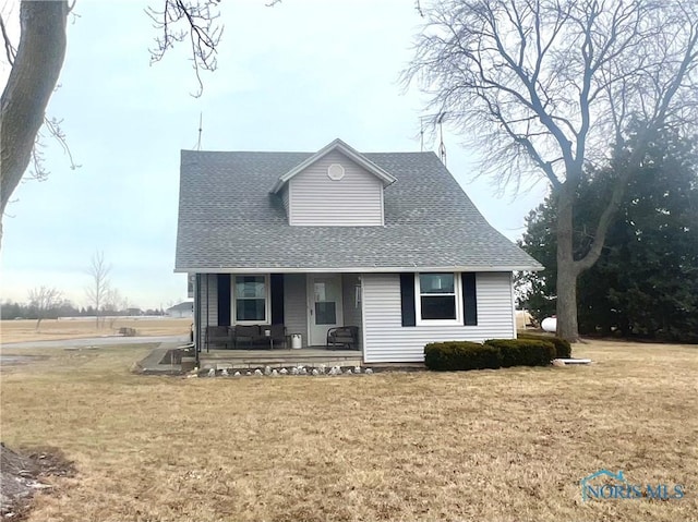 view of front of house featuring a porch and a front yard