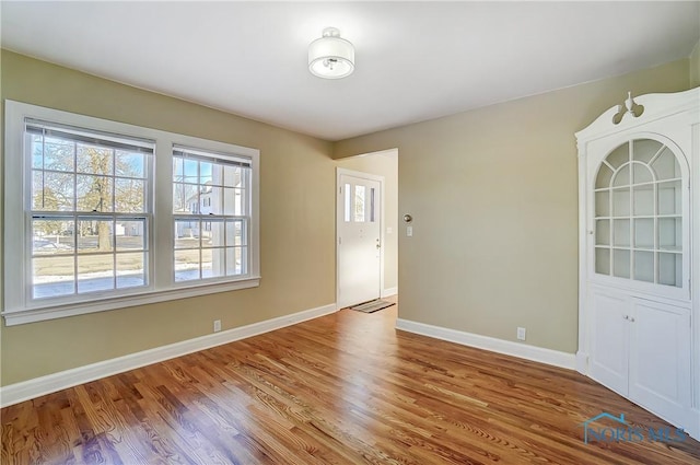 empty room with wood-type flooring