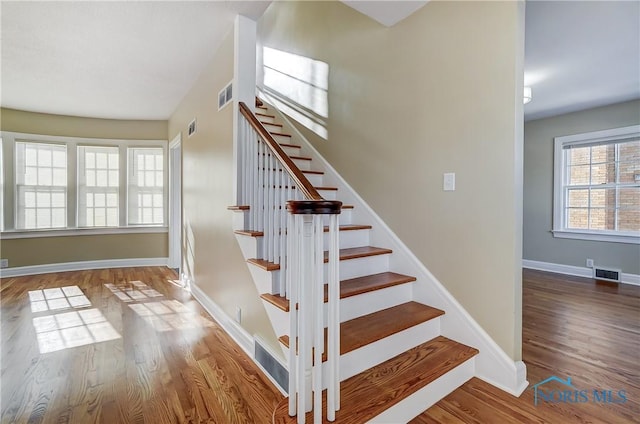 staircase featuring hardwood / wood-style floors