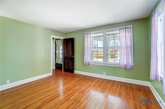 unfurnished room featuring light wood-type flooring