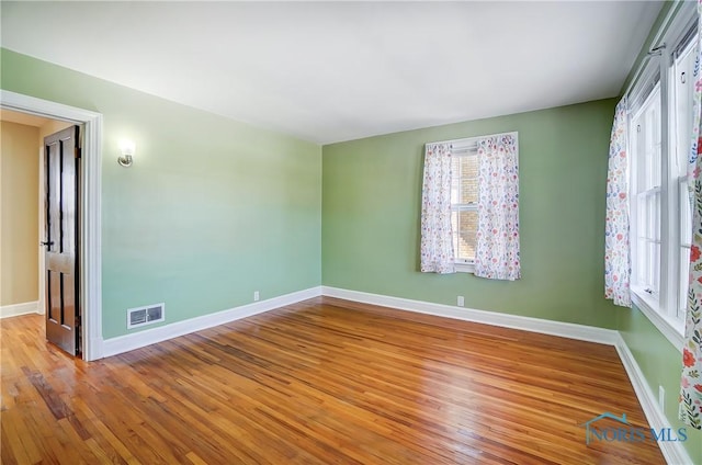 empty room with light wood-type flooring