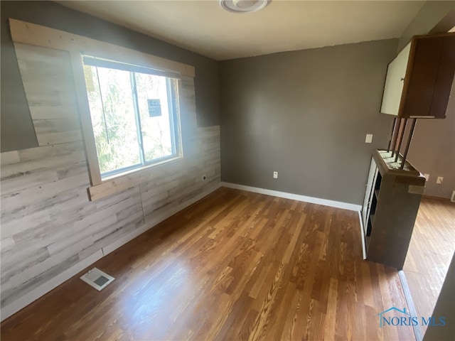 empty room with light hardwood / wood-style floors