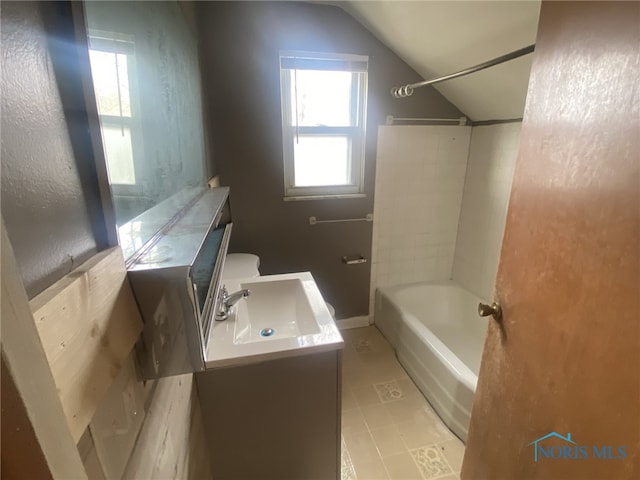 full bathroom featuring lofted ceiling, toilet, bathing tub / shower combination, and vanity